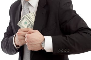 guy putting money in suit jacket pocket