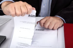 guy ripping up agreement