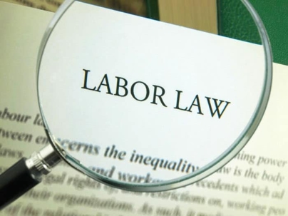 magnifying glass showing labor law
