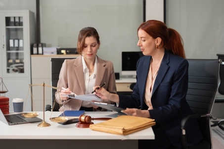 Teamwork of business lawyer meeting working hard about legal legislation in courtroom to help their customer.