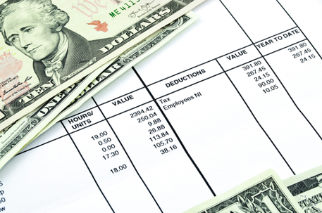 Payslip shows amount of earn with banknotes and coins